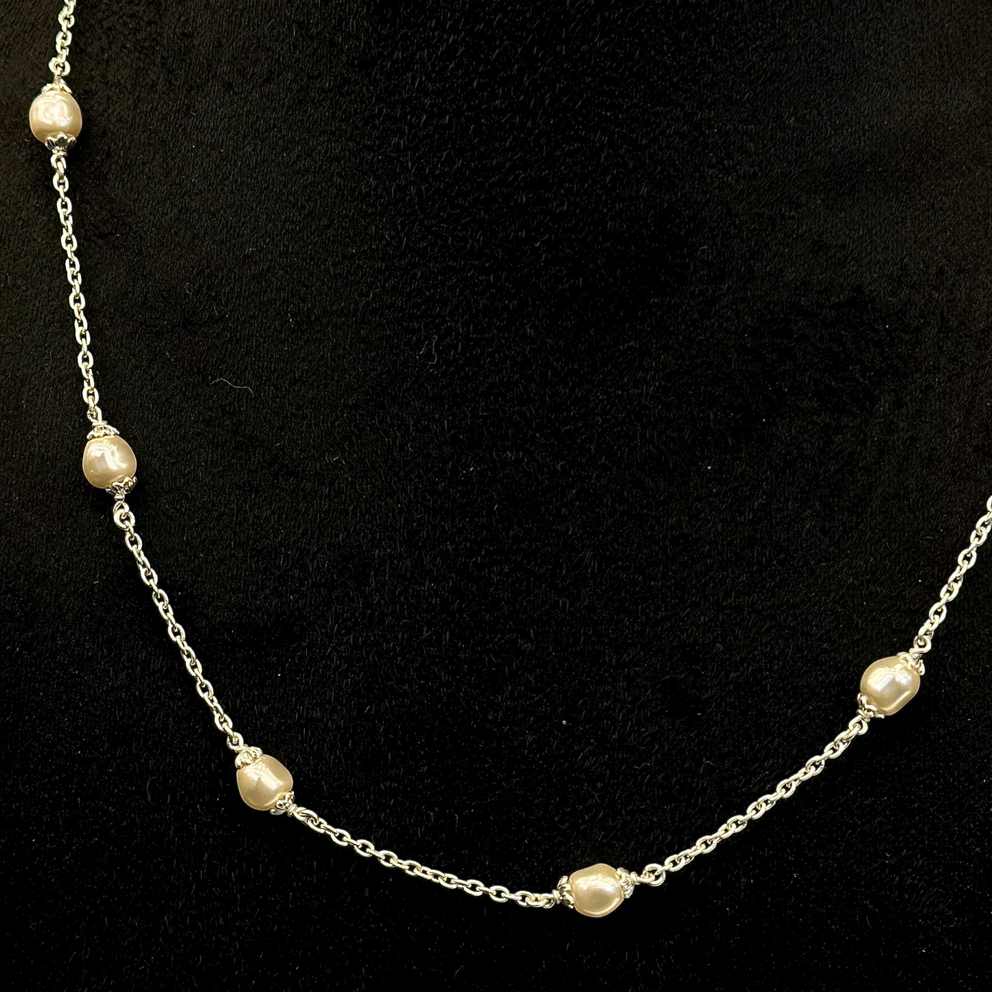 Pearl necklace on a black background