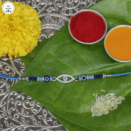 925 Silver Evil Eye Rakhi with Blue Beads – Protection & Style - The Aarna Jewels
