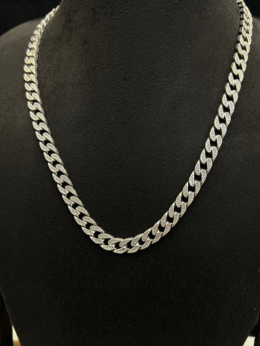 Silver chain necklace on a black mannequin