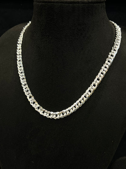 Silver chain necklace on a black mannequin