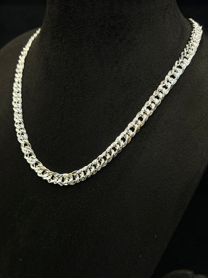 Silver chain necklace on a black mannequin
