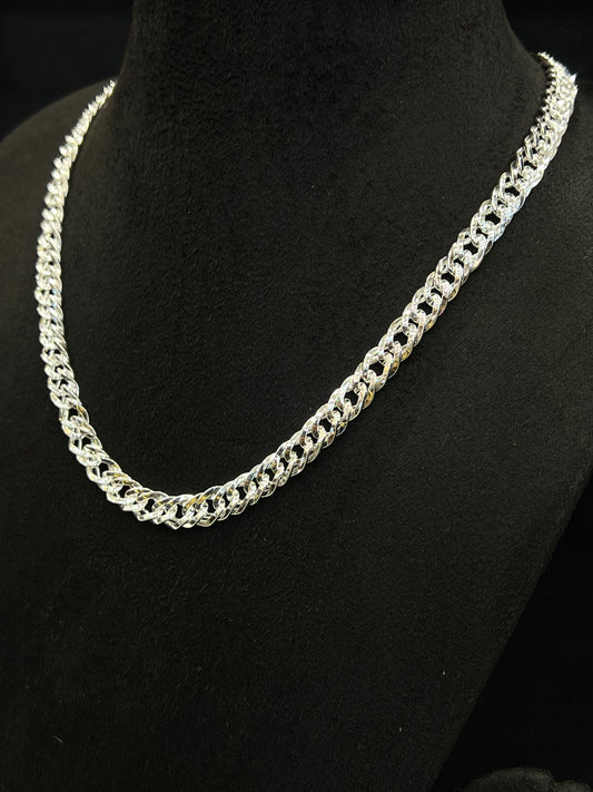 Silver chain necklace on a black mannequin