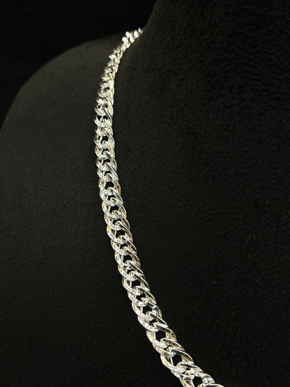 Silver chain necklace on a black mannequin