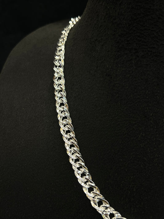 Silver chain necklace on a black mannequin