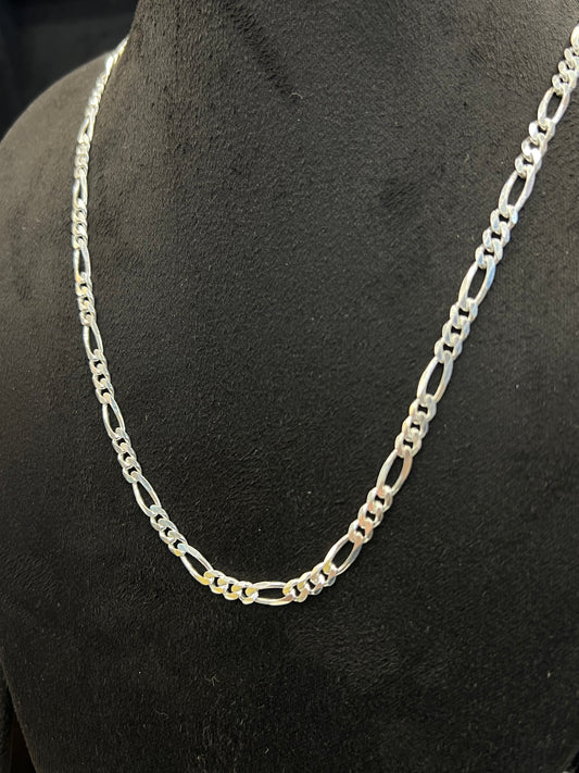 Silver chain necklace on a black mannequin bust