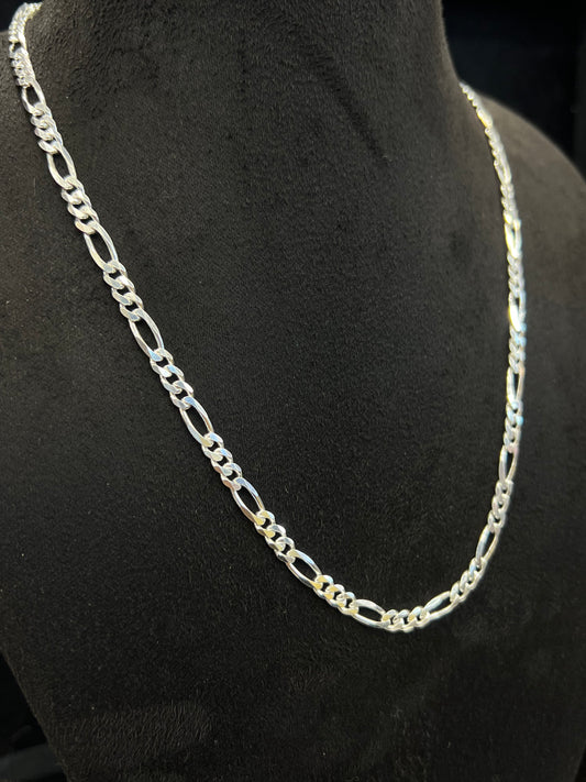 Silver chain necklace on a black mannequin bust