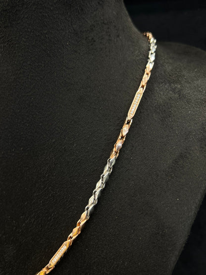 Two-tone gold and silver chain on a black mannequin