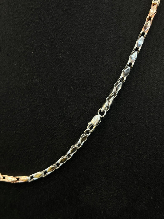 Gold chain on a black background