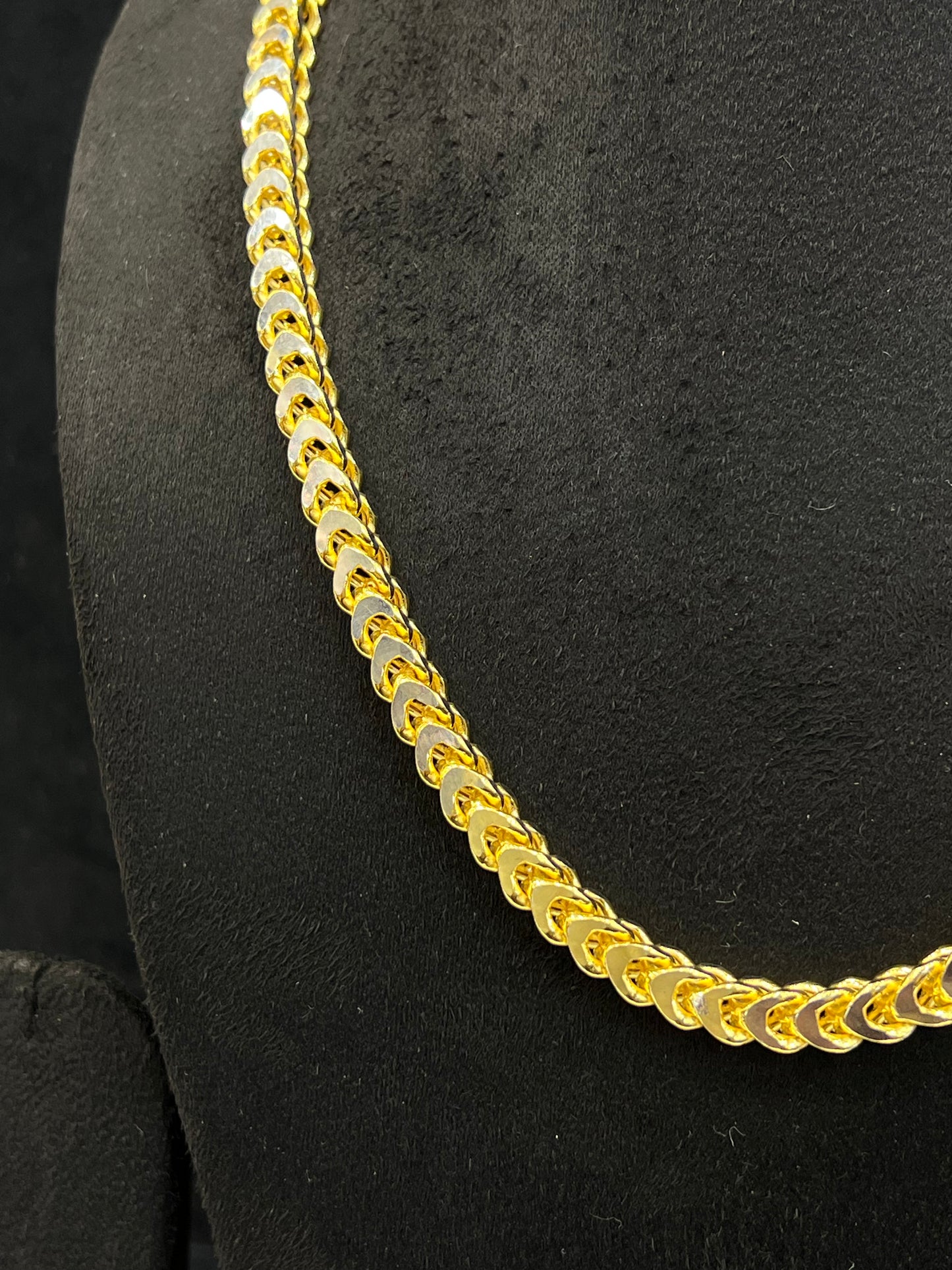 Gold chain on a black background