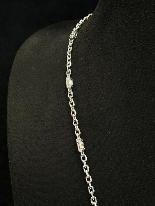 Silver bracelet on a black mannequin arm