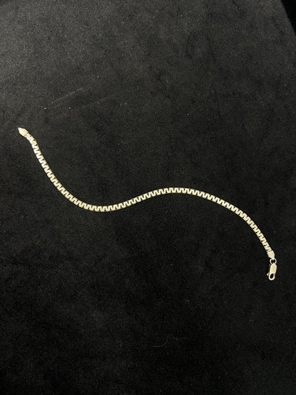 Gold chain on a black background