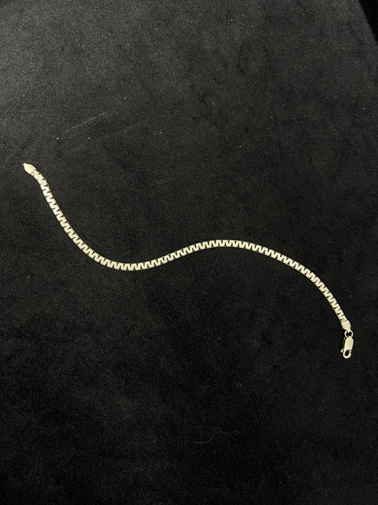 Gold chain on a black background