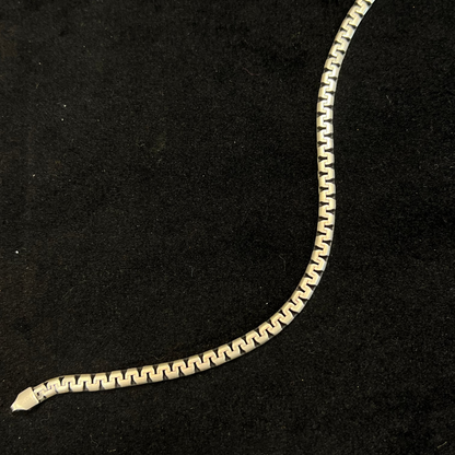 Gold chain on a black background