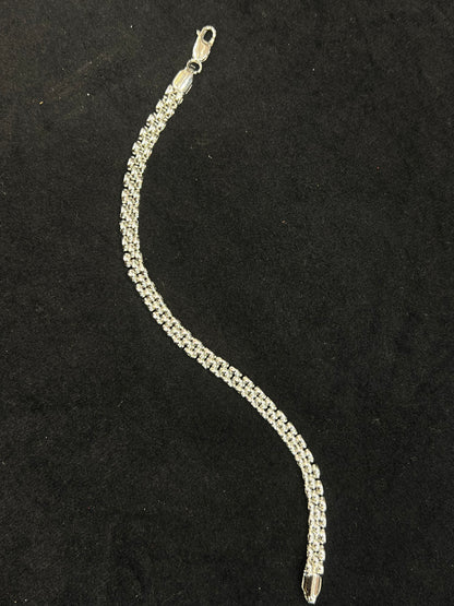 Silver bracelet on a black background