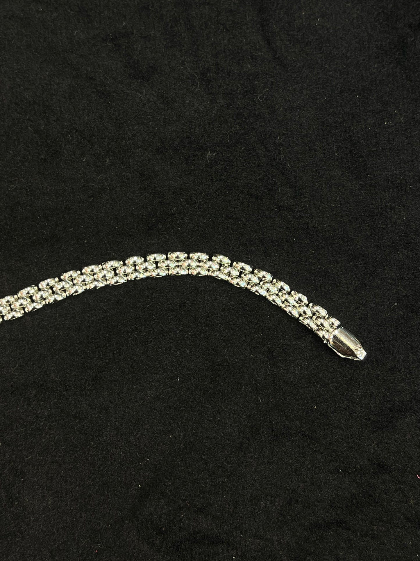 Silver bracelet on a black background