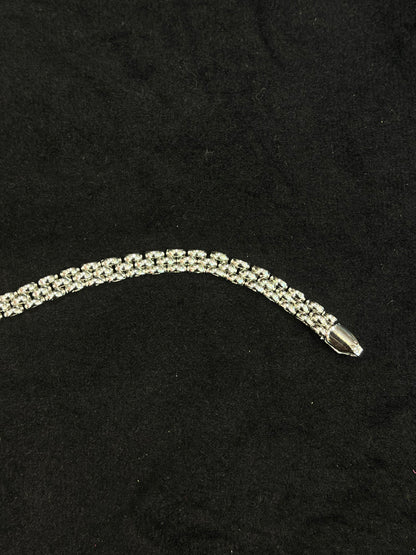 Silver bracelet on a black background