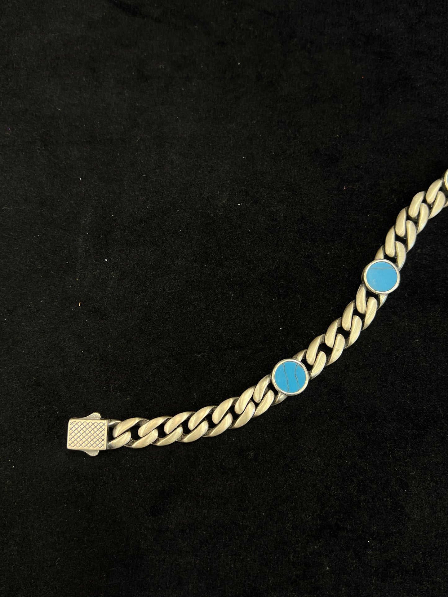 bracelet with blue stones on a black background