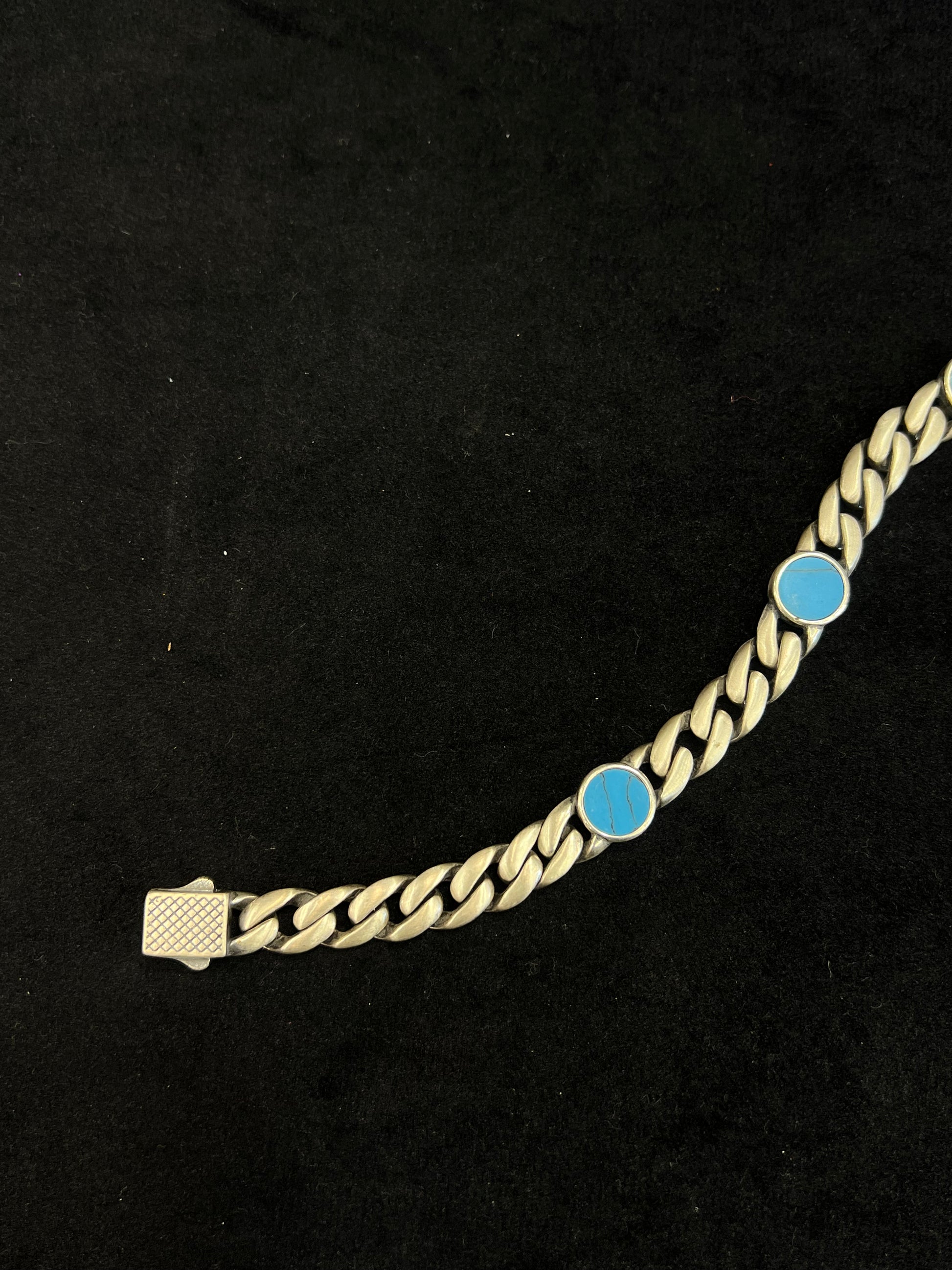 bracelet with blue stones on a black background