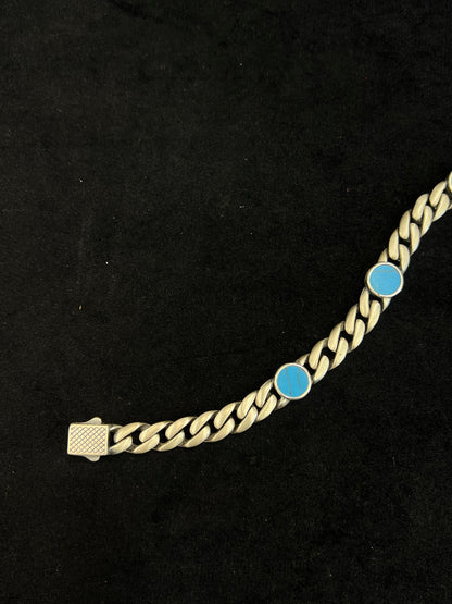 bracelet with blue stones on a black background