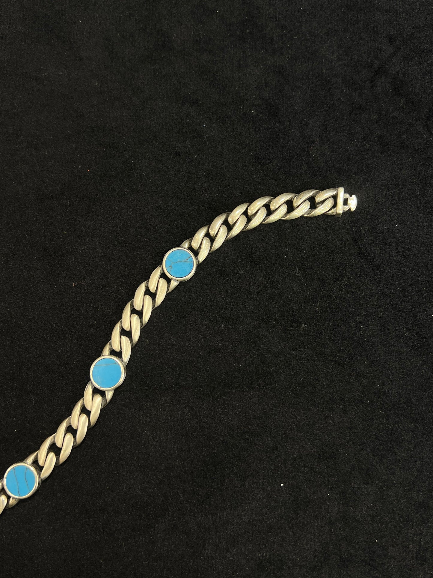 bracelet with blue stones on a black background