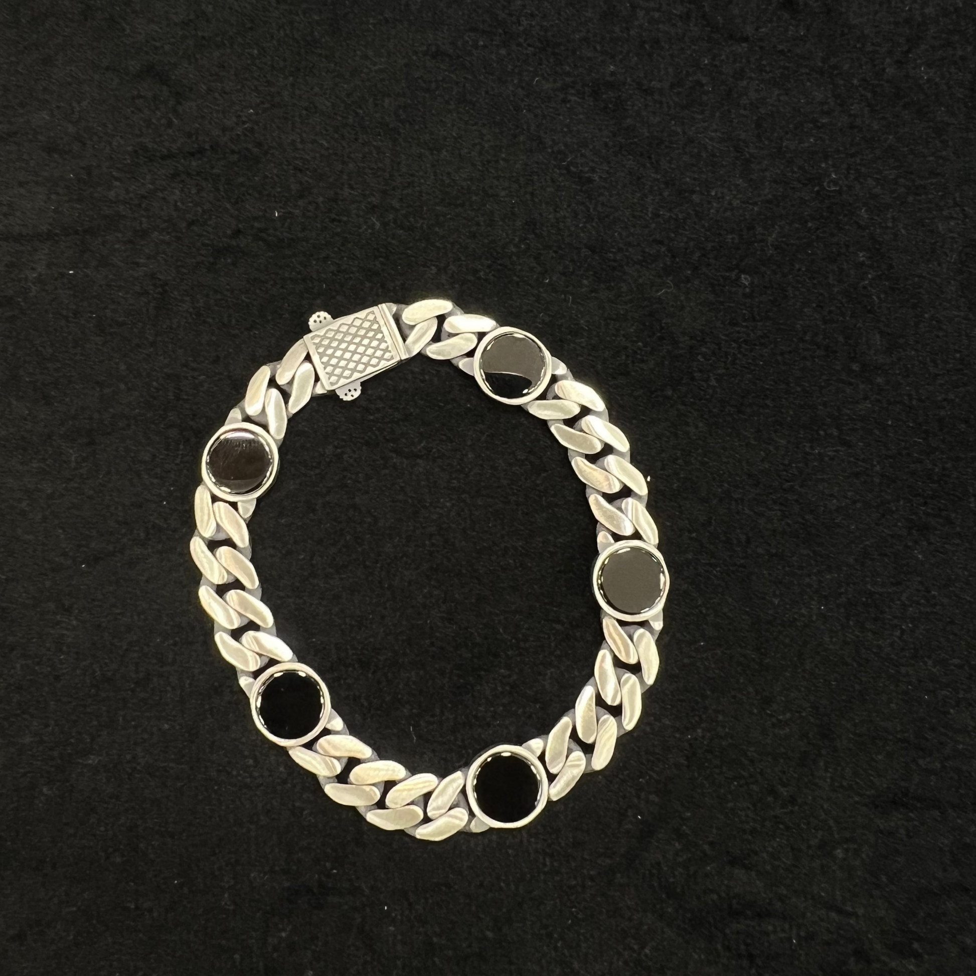 Bracelet with chain design on a black background