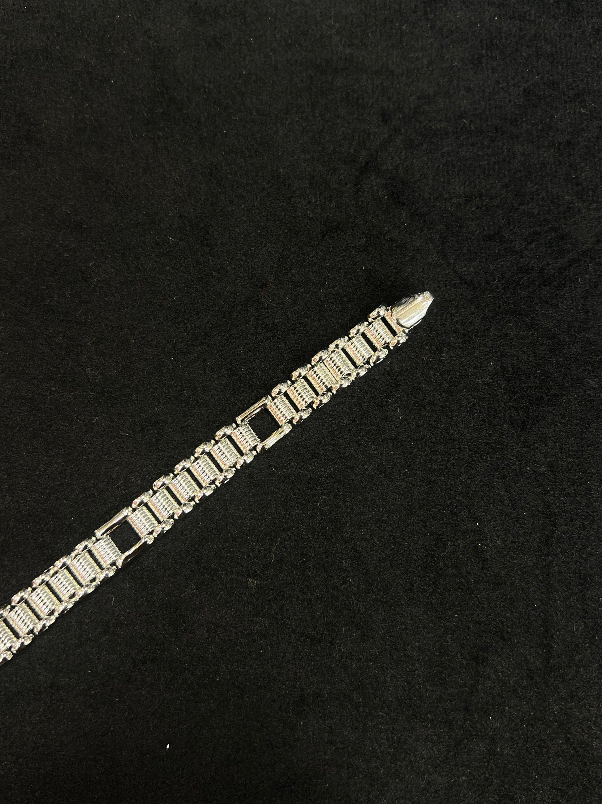 Gold bracelet on a black background