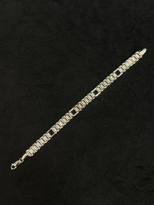silver bracelet on a black background