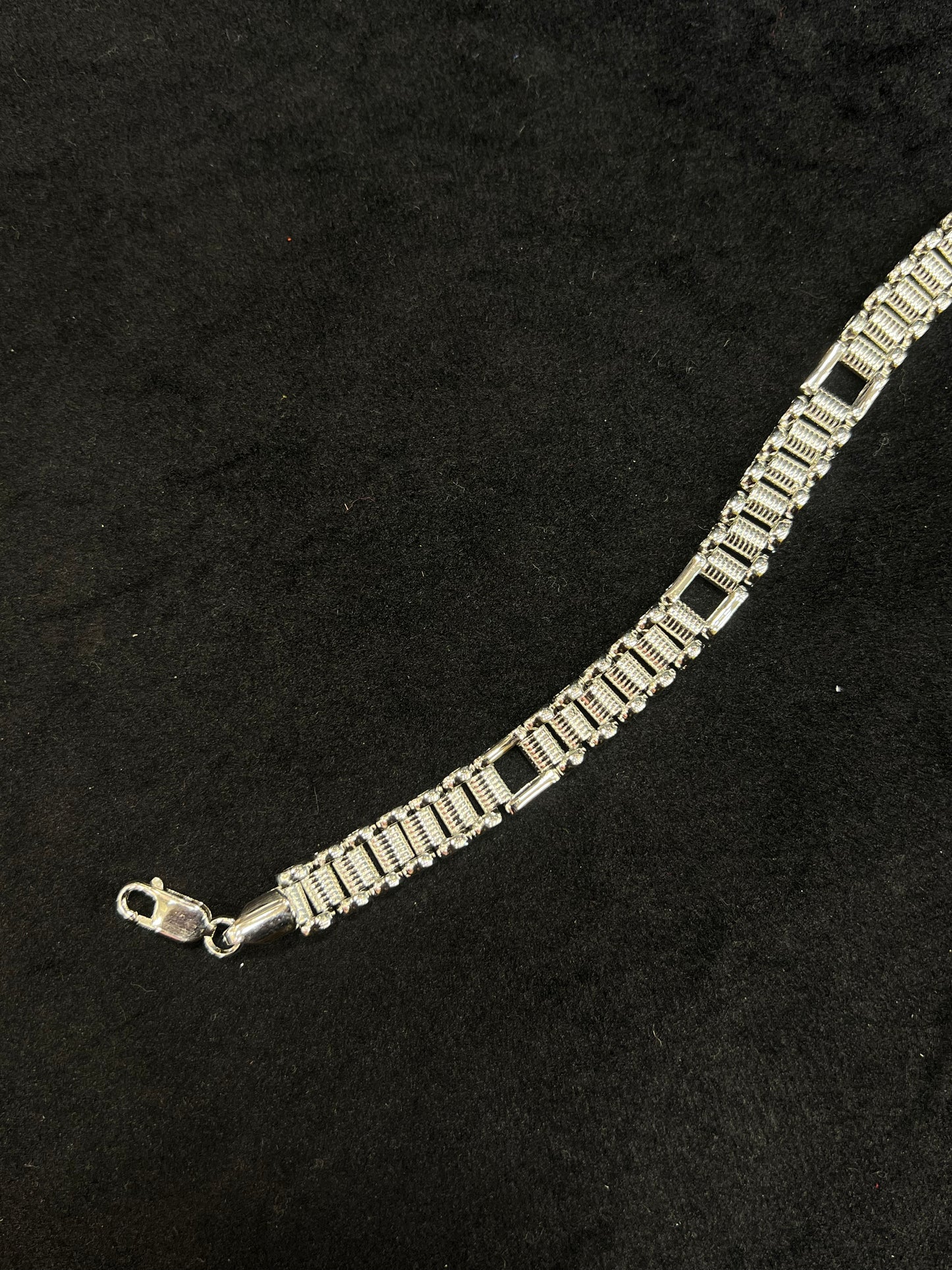 Silver bracelet on a black background