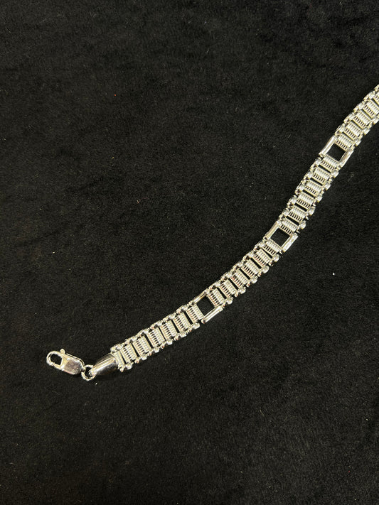 Silver bracelet on a black background