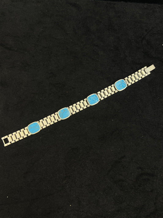 Bracelet with blue stones on a black background