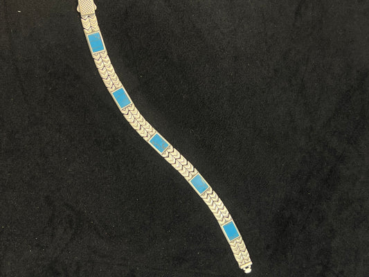 Bracelet with blue square stones on a black background