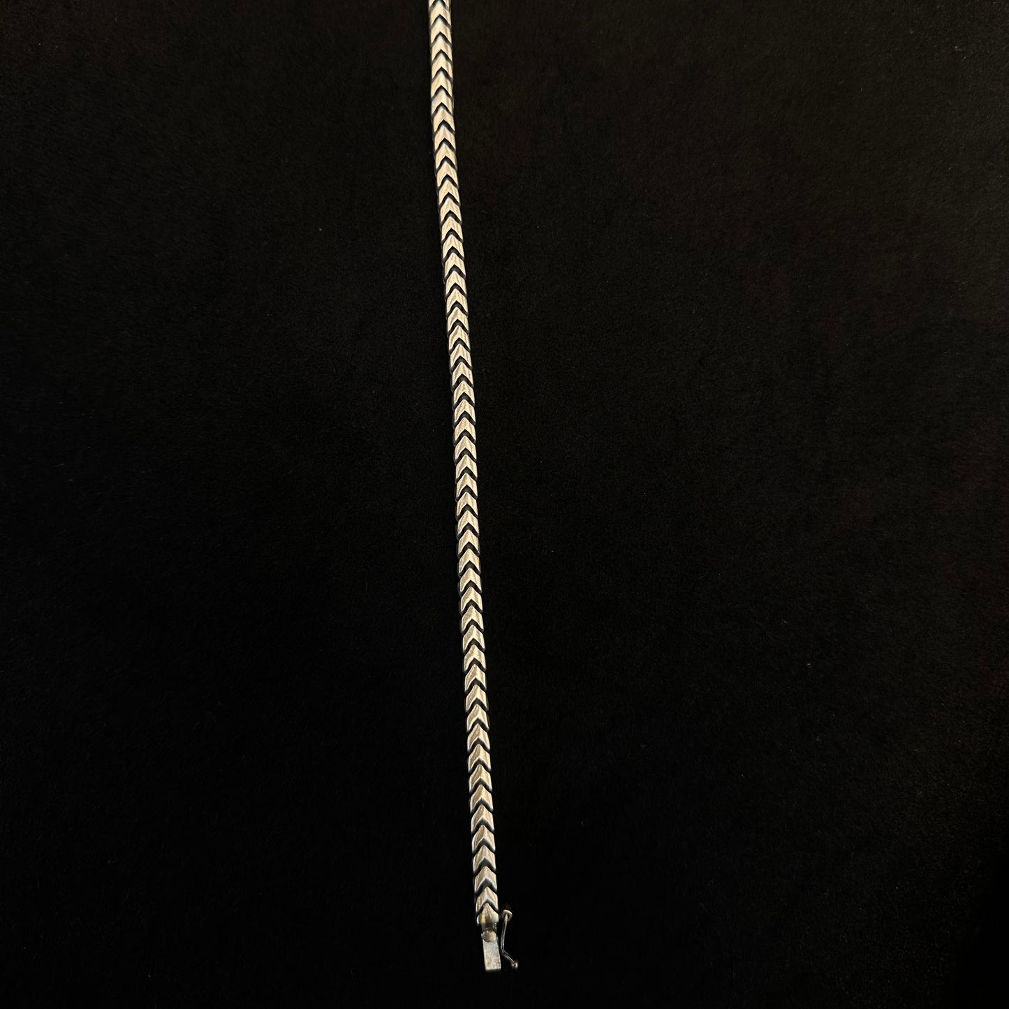 Bracelet with a zigzag pattern on a black background