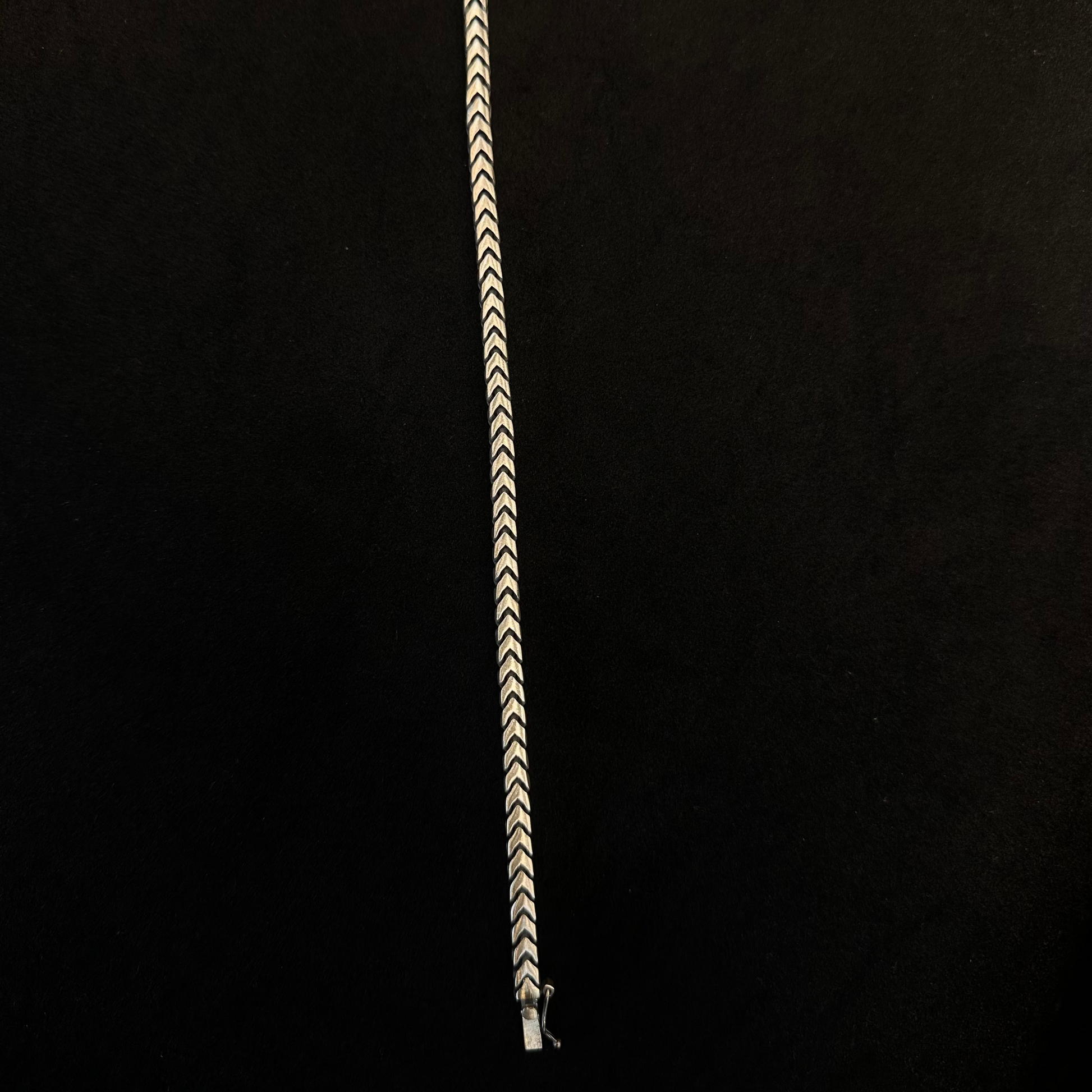 Bracelet with a zigzag pattern on a black background