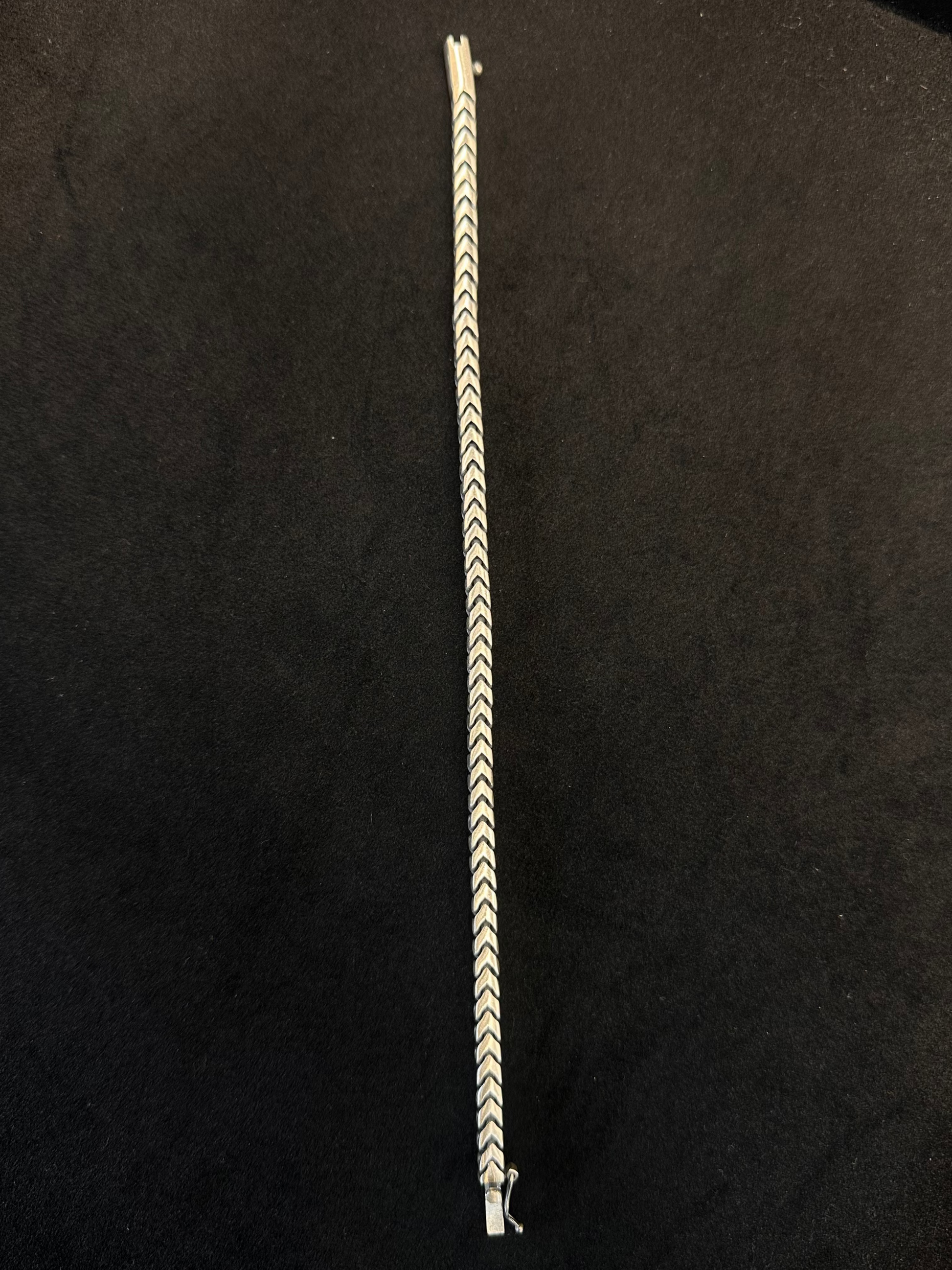 Bracelet with a chevron pattern on a black background