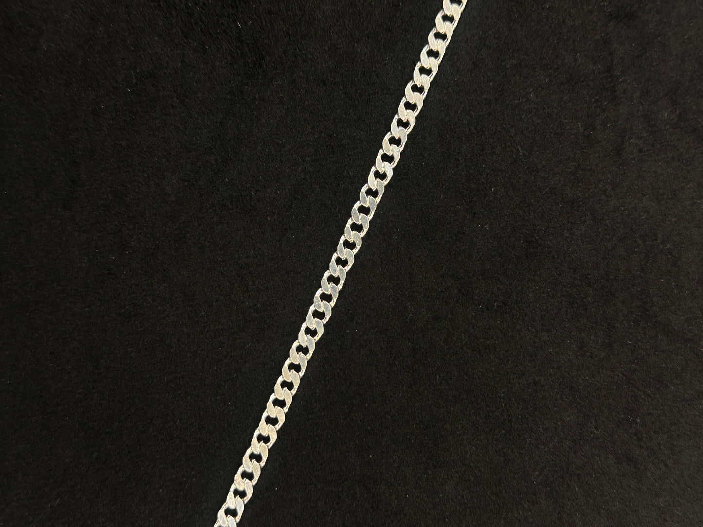 Silver chain on a black background