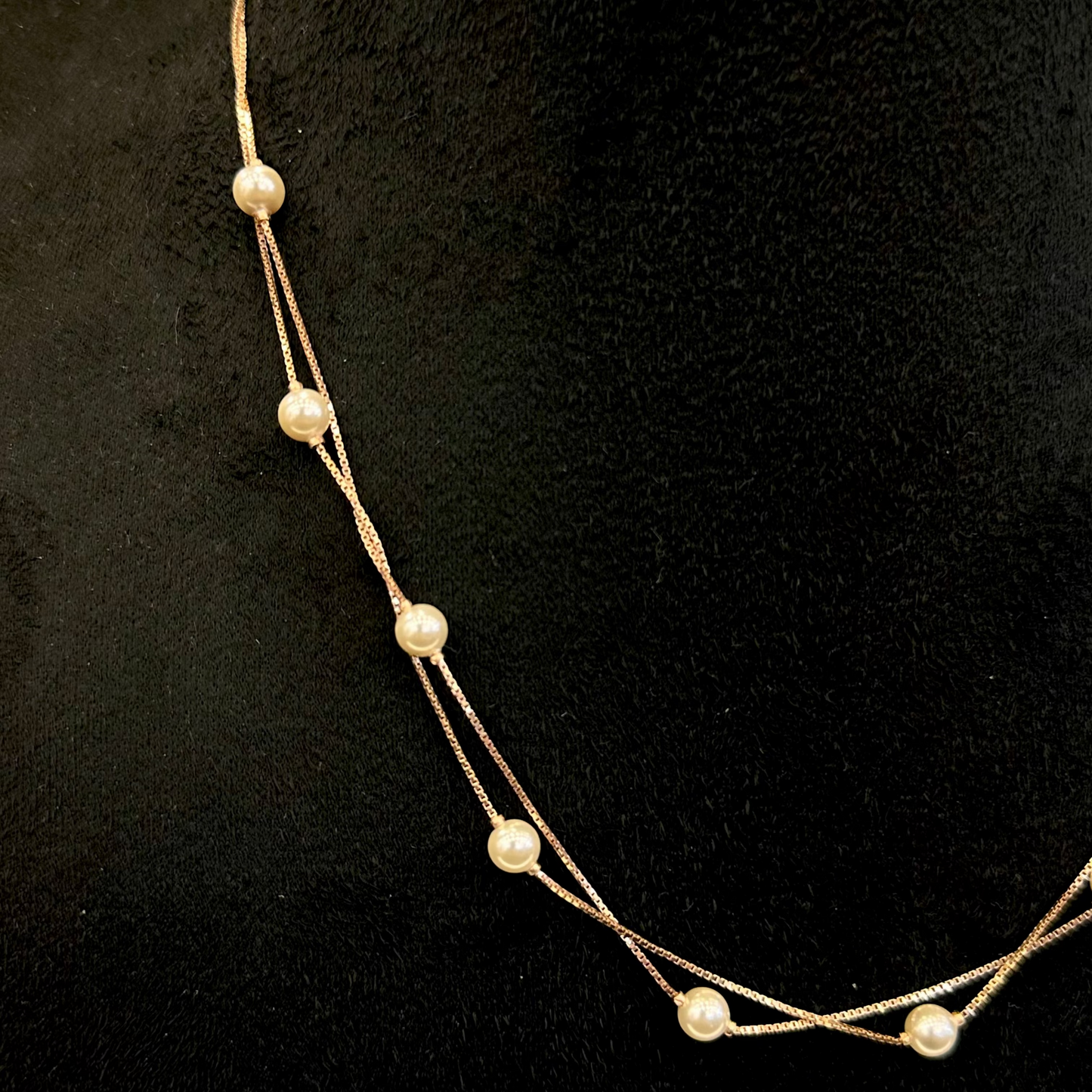 Pearl necklace on a black background