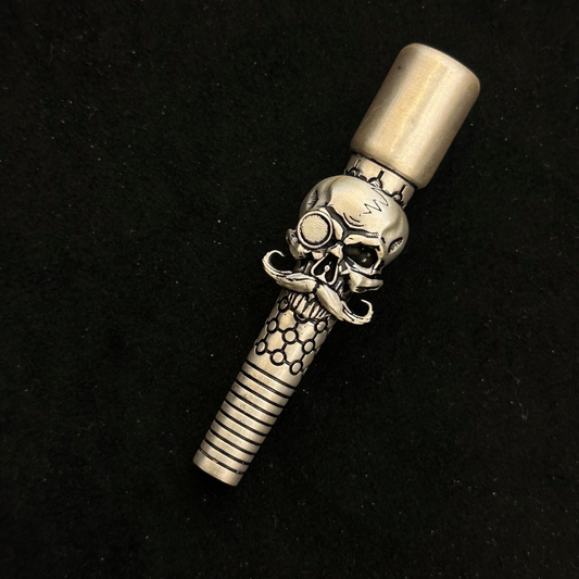 Silver skull and crossbones design on a black background