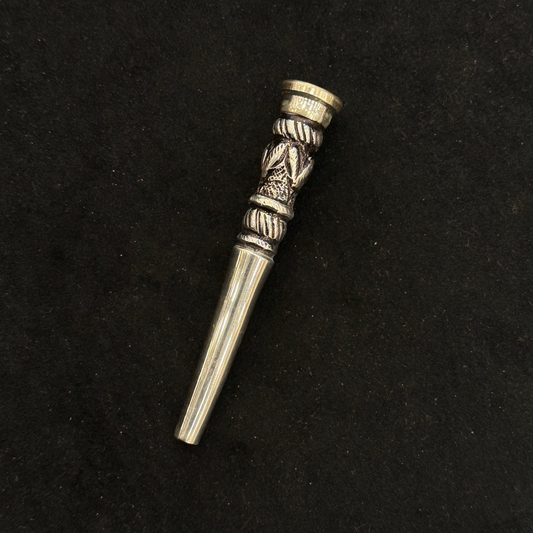 Silver decorative hookah pipe on a black background